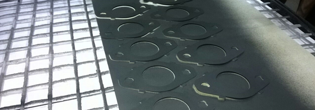 Dry film coating for exhaust gaskets